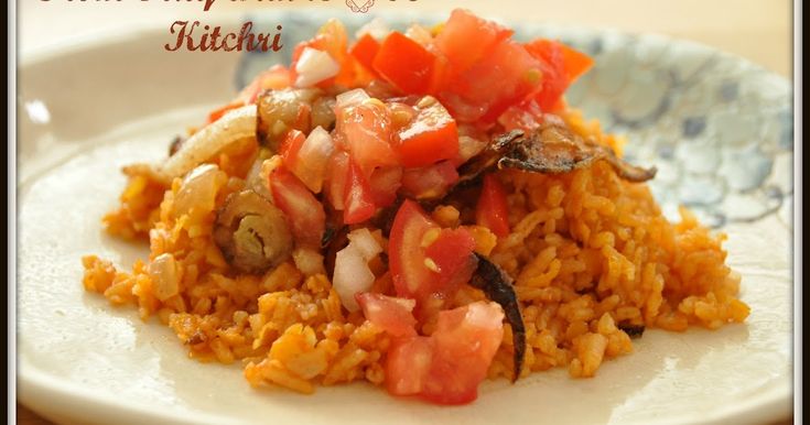 a white plate topped with rice and vegetables