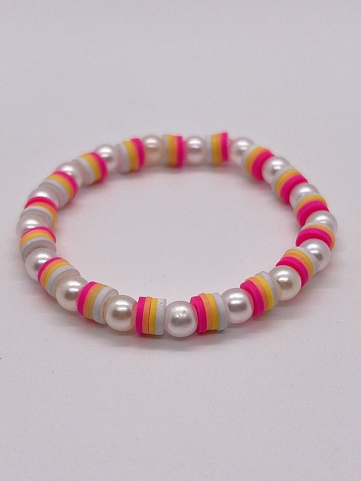 a bracelet with multicolored beads on it