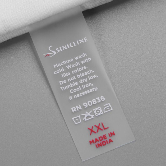 a label on the back of a white shirt that says, machine wash clothes wash with like colors do not touch