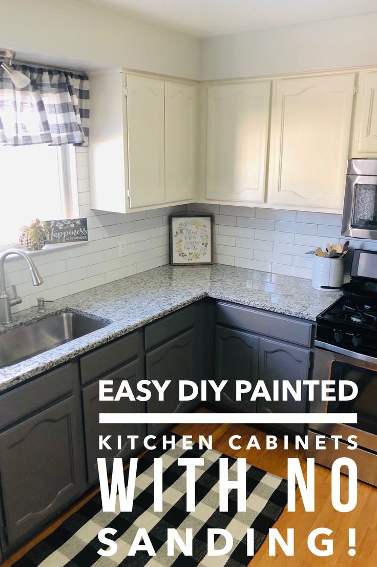 a kitchen with no sanding on the counter top and cabinets painted in black and white