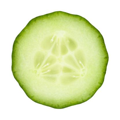 a cucumber cut in half on a white background with clipping area for text