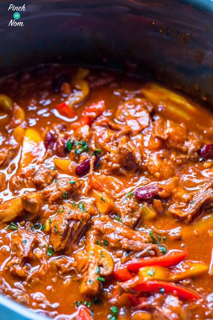 a large pot filled with meat and vegetables