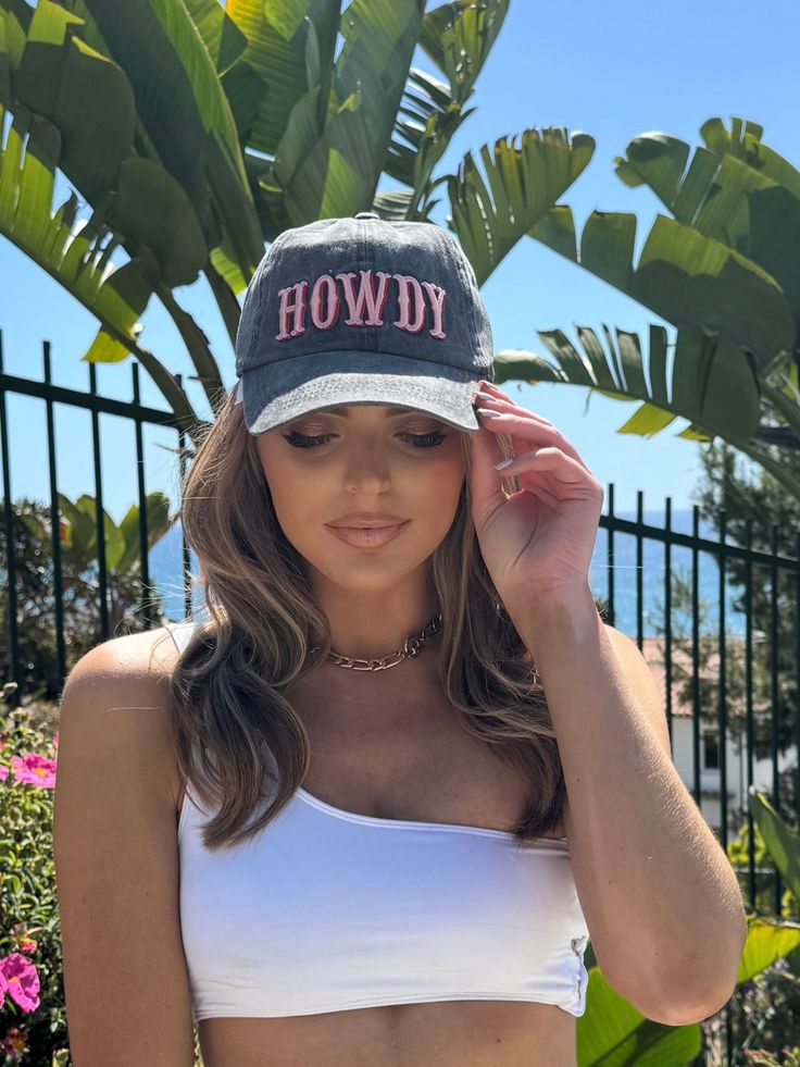 "Get ready to greet the day in style with the Hannah Howdy Baseball Hat! This trendy grey hat features a playful pink "Howdy" print, adding a fun and quirky touch to any outfit. Perfect for any casual occasion, this hat will have you looking effortlessly cool. Howdy, y'all!" Gray Baseball Cap For Summer, Gray Curved Brim Baseball Cap For Summer, Gray Summer Trucker Hat, One Size Fits Most, Gray Snapback Hat For Summer, Gray Summer Trucker Hat One Size, Gray Summer Snapback Hat, Trendy Gray Snapback Trucker Hat, Adjustable Gray Baseball Cap For Summer, Gray Adjustable Baseball Cap For Summer