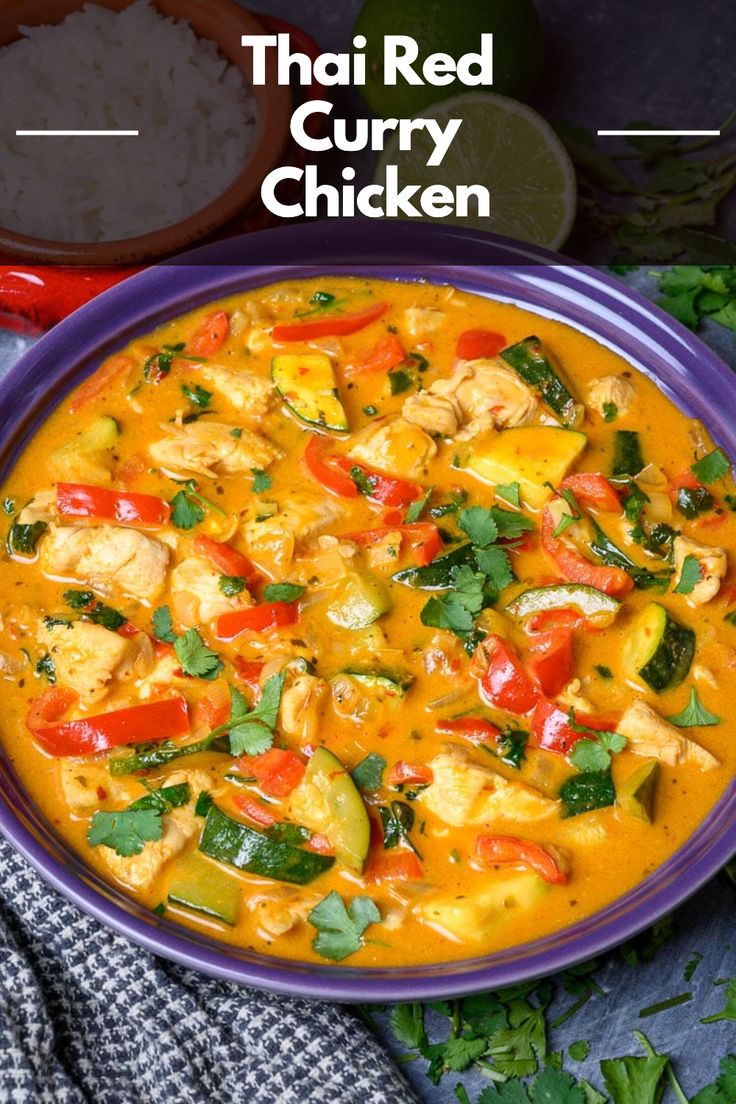 thai red curry chicken in a purple bowl with rice and cilantro on the side