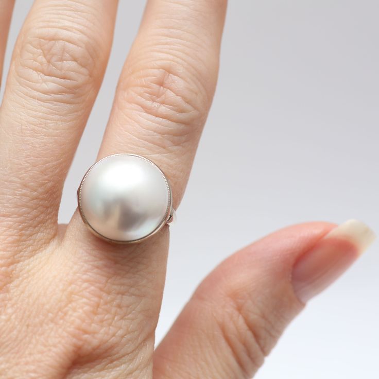 You'll be ready for cocktail hour with this stunning 14k white gold mabé pearl ring. Pearl is 16mm in diameter and has a fabulous luster. Ring size 5.25.Sizing availableLayaway available Cheap White Pearl Ring For Women, Pearl Ring Platinum, Watch Cufflinks, Ring Pearl, Mabe Pearl, Purple Jewelry, Be Ready, Cocktail Hour, Pearl Ring