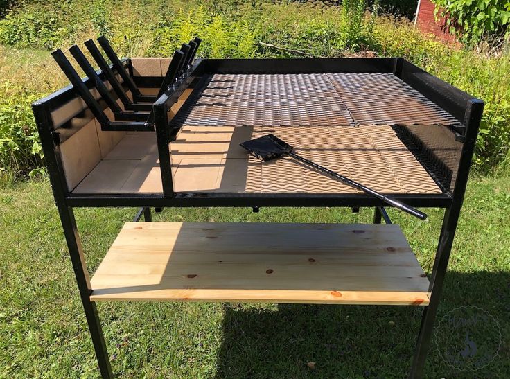 a grill with four chairs sitting on top of it