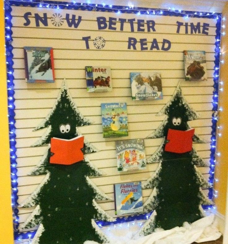 a bulletin board decorated with christmas trees and books