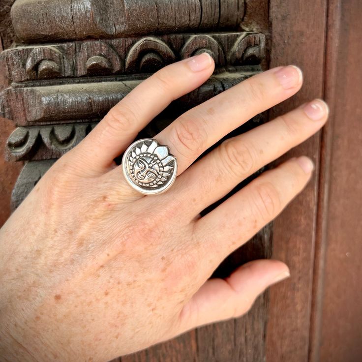 Beautiful sterling silver rings in the shape of the sun and moon. This collection of Sun & Moon jewelry is handmade by Desh and his family in Lalitpur, Nepal. Crafting silver jewelry for generations in the same family house in Nepal, Desh is an absolutely lovely man who explained the significance of the sun and moon symbols in Nepal to us. Similar to the yin & yang symbol, the sun and moon together symbolize the balance of energies. The moon is regarded as the female energy of calm insight and compassion. The sun is seen as the male energy of a bright mind bringing clarity. In Nepal, they are shown together to represent these two different energies working together within all of us. All rings are size ??? Unique Round Jewelry With Sun Design, Unique Round Sun Design Jewelry, Bohemian Sterling Silver Rings With Sun And Moon Design, Bohemian Sun And Moon Design Ring, Symbolic Sterling Silver Ring With Sun And Moon Design, Silver Sterling Sun Design Ring, Sterling Silver Sun Design Ring, Unique Sterling Silver Ring With Sun And Moon Design, Sterling Silver Sun Design Ring For Gift