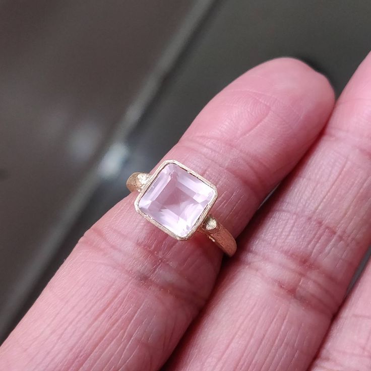 **KINDLY CHECK OUT THE VIDEO OF THE ITEM FOR A CLEARER VIEW**Details of the ring Gem: Rose Quartz Gem size & shape: 8 mm & octagon Center Gem weight: 2.60 carat Finish: matte Gold purity: 14K (58.33% approx.) Gold weight: 2.33 grams total weight of ring: 2.85 grams Fine faceted Rose Quartz gemstone ring set in solid 14K yellow gold in matte finish. The Gold purity is guaranteed and it comes with authentic 14 kt gold hallmark. Since these Rings are handmade, Size Customization is availabl 14k Rose Gold Crystal Gemstone Ring, Rose Gold Crystal Gemstone Ring In 14k Gold, Rose Gold Solitaire Crystal Ring, Rose Gold Gemstone Birthstone Ring As Gift, Rose Gold Crystal Ring With Birthstone For Formal Occasions, Luxury Rose Gold Amethyst Ring As Gift, 14k Rose Gold Jewelry With Gemstones, Fine Jewelry Rose Gold Rings With Bezel Setting, Faceted Rose Gold Ring Jewelry