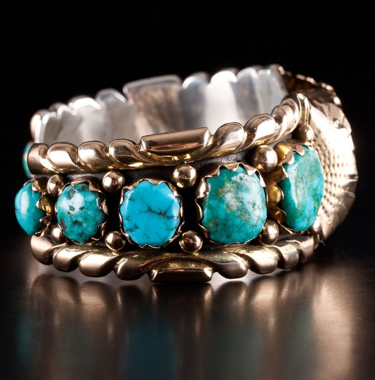 Vintage 14k Yellow Gold & Sterling Silver Zuni Morenci Turquoise Cuff BraceletMetal Information: 14k Yellow Gold & Sterling SilverTotal Weight: 86.2gBracelet Width: 27mmBracelet Length: 5.25"Bracelet Opening: 1.5"Circa: 1970'sCenter Stone: MorenciSide Stones: Sleeping BeautyStone InformationMain StoneGem Type: Morenci TurquoiseShape: Cabochon (25 x 20mm)Color: BlueClarity/Quality: ANumber of Stones: 1Accent StonesGem Type: Sleeping Beauty TurquoiseShape: Oval (13.8 x 12mm)Color: Blue / GreenClar Heirloom Turquoise Round Jewelry, Southwestern Style Jewelry With Polished Finish For Anniversary, Southwestern Style Polished Jewelry For Anniversary, Turquoise Bracelet Jewelry Collectible, Luxury Turquoise Jewelry For Anniversary, Unique Turquoise Jewelry With Polished Finish, Southwestern Turquoise Jewelry For Weddings, Turquoise Bangle For Formal Occasions, Formal Turquoise Bangle Jewelry