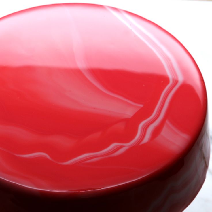 a red object sitting on top of a table