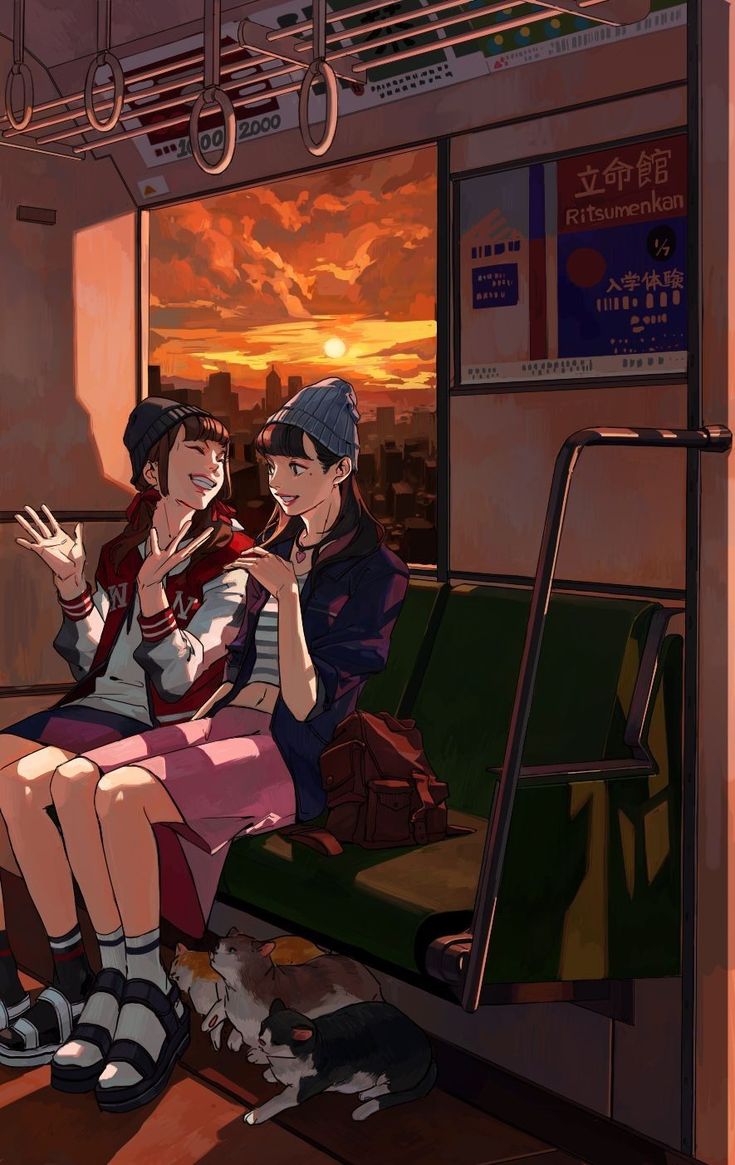 two people sitting on a train looking out the window