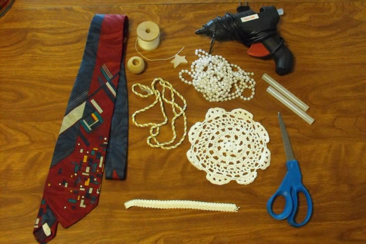 various items are laid out on the floor to be used as jewelry making tools and crafts