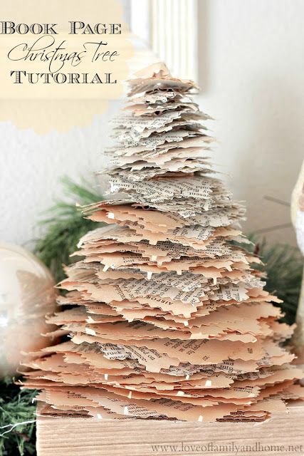 a book page christmas tree sitting on top of a table