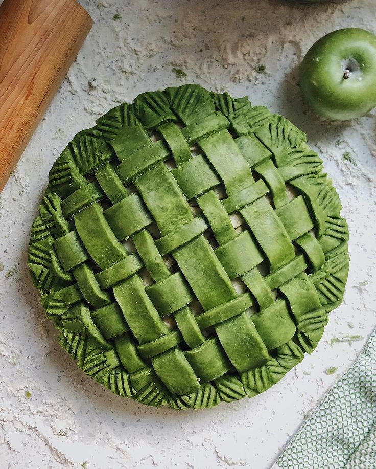 an apple pie sitting on top of a table