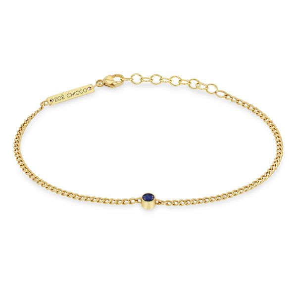 14k Blue Sapphire Bezel XS Curb Chain Bracelet Yellow Gold Sapphire Jewelry With Round Stone, Yellow Gold Single Diamond Bracelet, Sapphire Bangle Gift Jewelry, Sapphire Bangle Jewelry Gift, Sapphire Gemstone Bangle Jewelry, Minimalist Sapphire Jewelry With Prong Setting, Fine Sapphire Bangle Jewelry, Elegant Adjustable Blue Gold Bracelet, Luxury Sapphire Round Stone Jewelry