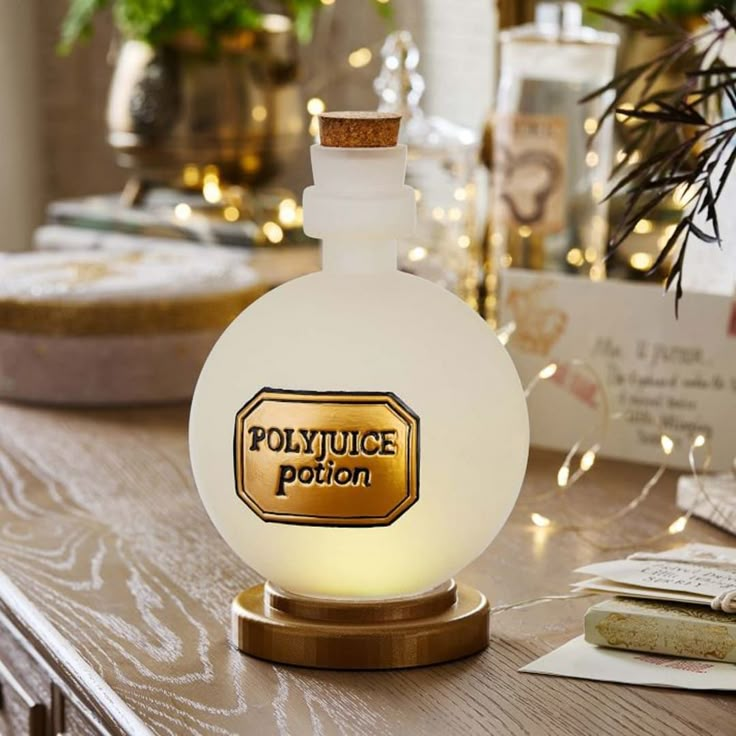 a glass bottle sitting on top of a wooden table