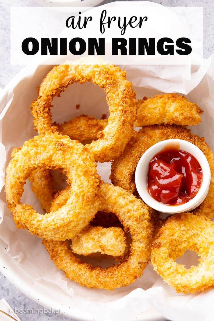 fried onion rings with ketchup in a bowl