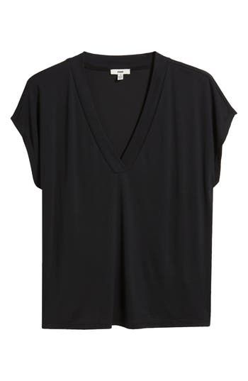 This nicely draped V-neck top is made from supersoft, fluid knit fabric with dropped shoulders to further the casual-chic look. 23 1/2" length V-neck Short sleeves 79% Tencel® modal, 21% polyester Tencel modal is a more-sustainably produced fiber made with closed-loop processing and is certified with the EU Ecolabel as having a low environmental impact throughout the entire lifecycle Machine wash, dry flat Made in Turkey Hairstyling Products, Rollerball Perfume, Fragrance Design, Environmental Impact, Black Fits, V Neck Tops, Travel Size Products, Casual Chic, Knit Fabric