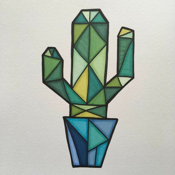 a stained glass cactus sitting on top of a white wall