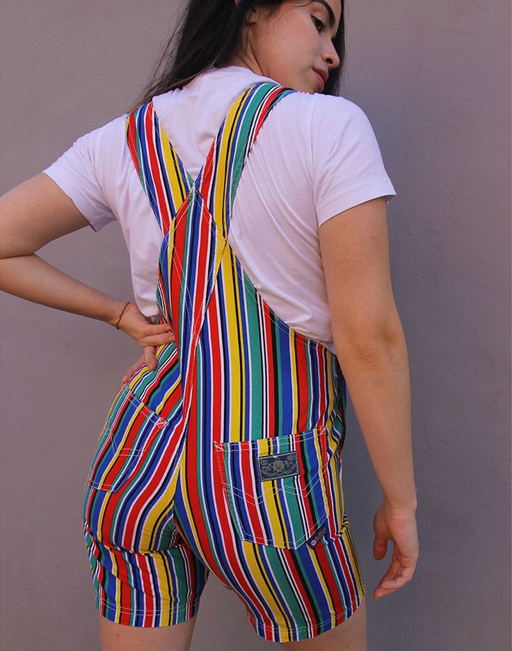 Vintage dungaree shorts in a multi colour stripe. Single chest pocket. Front and back lower pockets. Adjustable shoulder straps. Size small, UK 6-8 / EUR 34-36. Measurements - 7"(18cm) bib height - 13"(33cm) bib width - 28"(71cm) waist - 34"(87cm) hips - 7"(18cm) inner leg. Material - Cotton. Condition - Excellent. Handpicked, repaired and ready to wear. This is an original vintage item, not new and minor signs of wear & age are expected, we will highlight any major flaws.Model is a UK 8 and is 5'6" tall. Dungaree Shorts, Womens Denim Overalls, Overalls Denim, Dungarees Shorts, Womens Denim, Denim Romper, Denim Overalls, Color Stripes, Dungarees