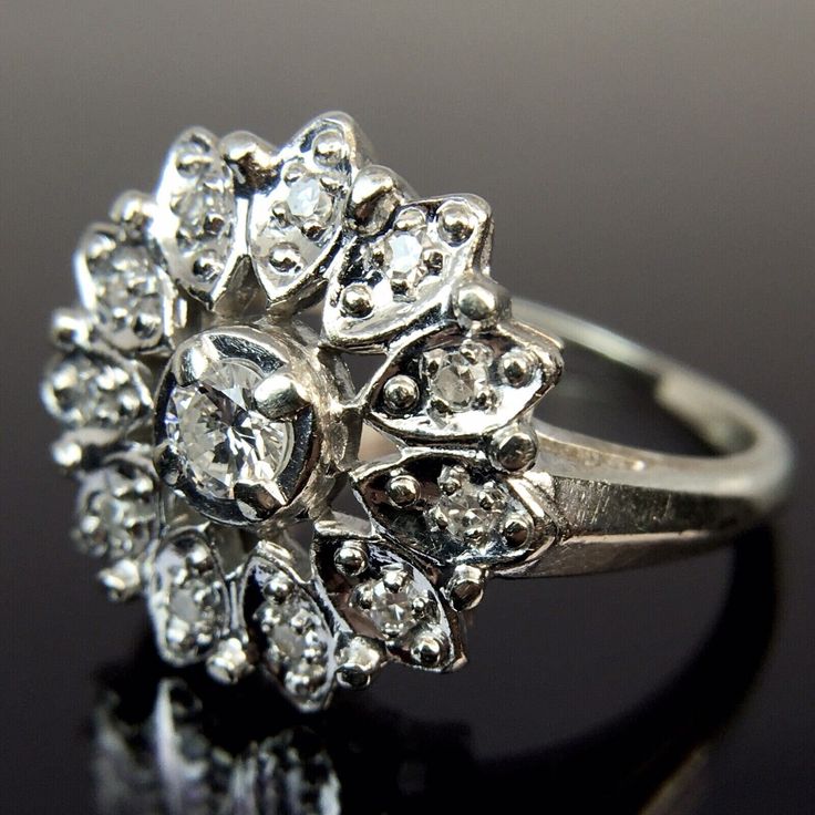 Metal:14k White Gold Weight:4.8 Grams Size:7 CTW:0.34 Carats 1 3.5mm diamond, approx. 0.17 carats 11 1.5mm diamonds, approx. 0.17 carats Make an offer! Dazzling Cluster Ring With Diamond Accents And Round Cut, Silver Halo Diamond Ring With Brilliant Cut, Silver Diamond Halo Ring With Brilliant Cut, Dazzling Diamond Ring For Formal Occasions, Cluster Diamond Promise Ring, Dazzling Diamond White Platinum Diamond Ring, Diamond Cut Halo Diamond Ring For Anniversary, Moissanite Cluster Ring With Diamond Accents In White, Silver Diamond Halo Ring