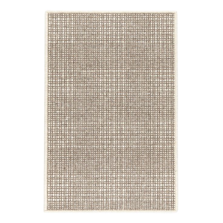 a beige and white rug on a white background