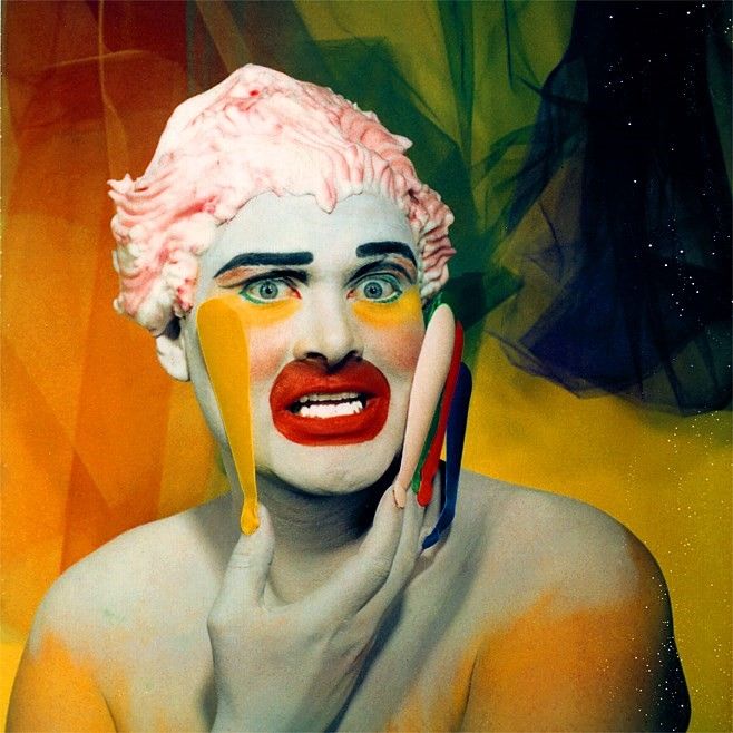 a painting of a woman with white hair and makeup on her face, painted in yellow and red