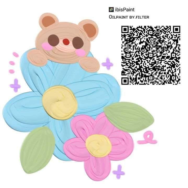 a teddy bear sitting on top of flowers next to a qr code for an appliance