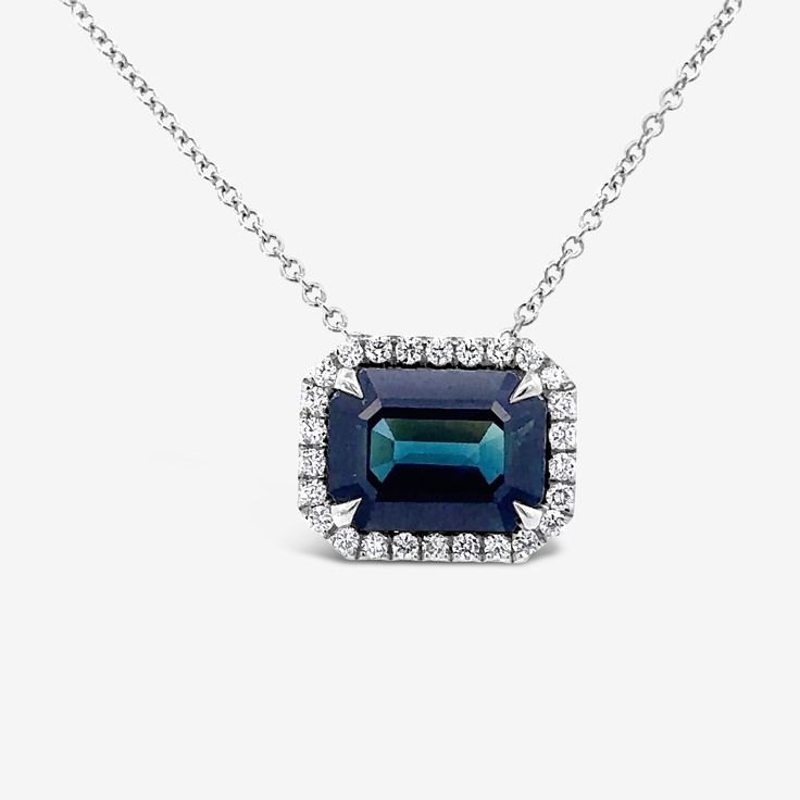 This stunning necklace combines Blue Sapphire and Diamonds for a look that radiates luxury. The 4.20ct Emerald Cut Sapphire is top top gem quality, surrounded by a halo of White Diamonds. Add a touch of timeless elegance to your jewelry collection. Blue Sapphire 4.20ct Natural Round Diamonds 0.28cttw 18K White Gold Length: 18"Inches Luxury Sapphire Necklace With Halo Setting, Sapphire Diamond Necklace, Bracelet And Ring, Matching Bracelet, Natural Blue Sapphire, Top Top, Stunning Necklace, Matching Bracelets, Sapphire Diamond