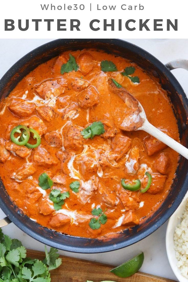 a pan filled with food next to rice and cilantro