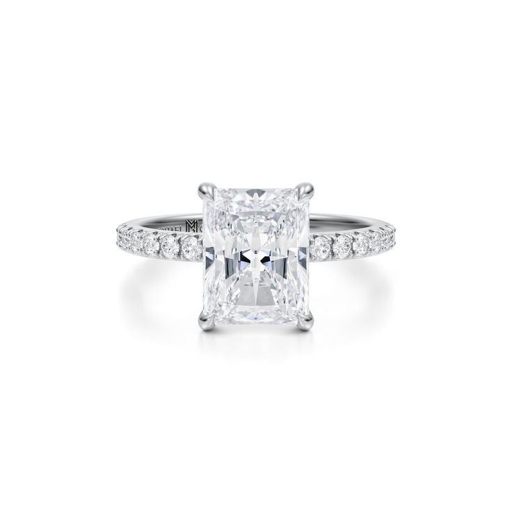 a princess cut diamond ring with pave set shoulders