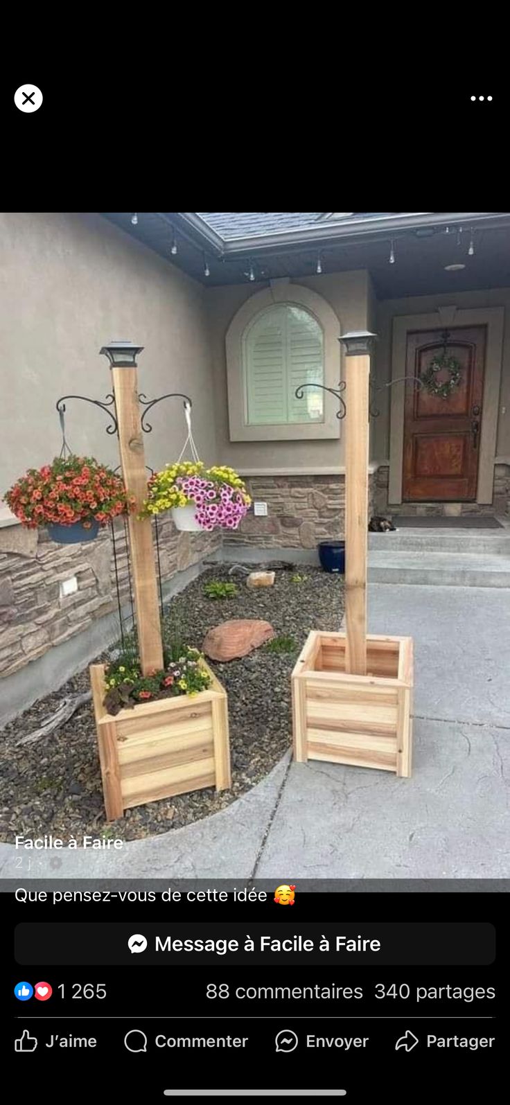 two wooden planters in front of a house