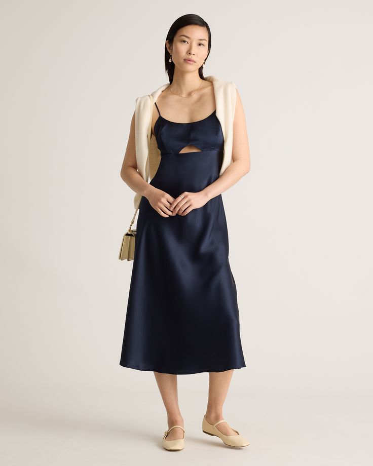 A playful twist on a classic silk dress, meet our 100% Washable Silk Cutout Midi Slip Dress. This super flattering fit is made from 100% mulberry silk, in a satin finish. The kicker? Our silk is washable. Easy to style, easy to wash for low-maintenance luxe. Plus, silk fiber contains 18 kinds of amino acids that make it amazing for skin nourishment, hypo-allergenic, and naturally thermoregulating to help maintain body temperature.  | Quince | Women's Cutout Midi Slip Dress in Navy, Size Medium, Silk Satin Dress With Bias Cut For Date Night, Silk Modal Satin Dress For Date Night, Silk Satin Dress For Date Night, Silk Satin Bias-cut Dress For Date Night, Silk Midi Dress With Satin Finish, Chic Silk Midi Dress With Satin Finish, Chic Silk Slip Dress For Brunch, Elegant Silk Satin Dress For Brunch, Elegant Viscose Slip Dress For Brunch