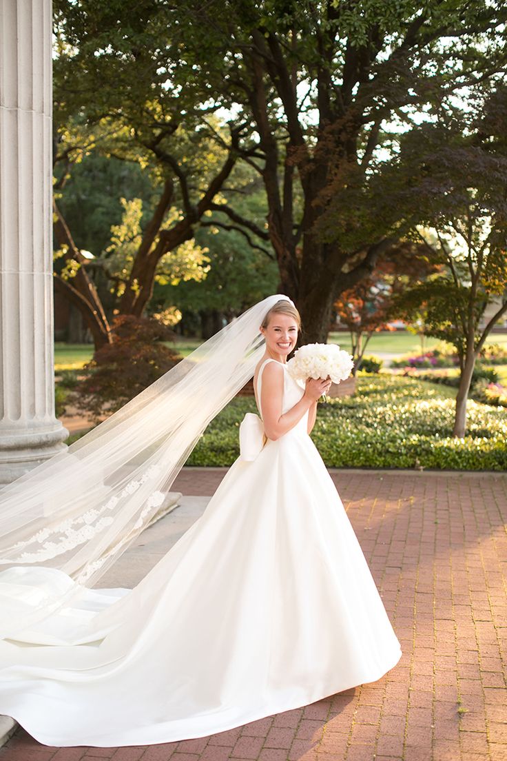 a woman in a wedding dress and veil