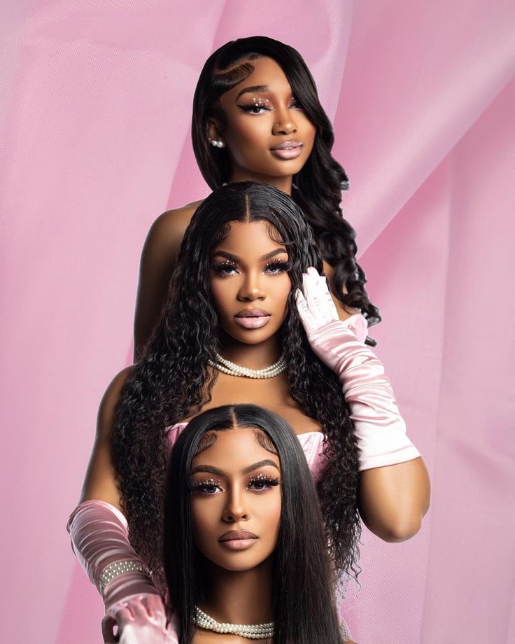 two black women with long hair and gloves