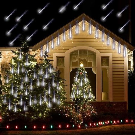 christmas lights decorate the outside of a house