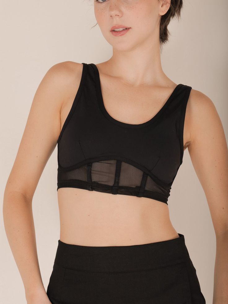 Meet the Sia Active Bustier – where function meets fashion! With its scoop neck, removable padding, and ultra-stretchy, mesh corset design, this cropped bustier is perfect for your active days or a night out. Pair it with high-waisted leggings for a workout or style it with a chic blazer and jeans for a trendy evening look. Details Scoop Neck Removable Padding Bustier Style Mesh Corset Design Cropped Length Ultra Stretchy Blazer And Jeans, Quilted Outerwear, Corset Design, Classic Closet, Mesh Corset, Summer Escape, Chic Blazer, Outfit Shop, Evening Look