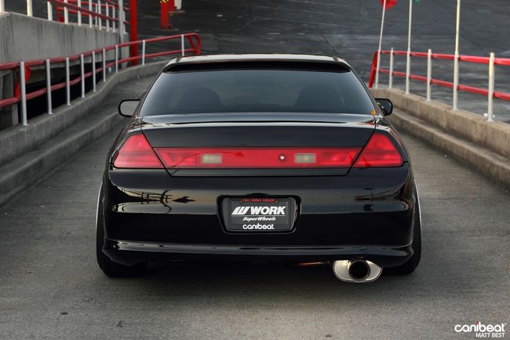 the back end of a black sports car