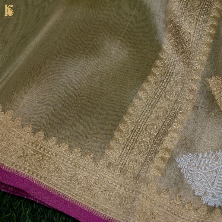 Khinkhwab brings you an exclusive Saree range- specially crafted for Khinkhwab by our weavers for the festive season. This is an exclusive limited edition in Silk and tissue fabrics with an elaborately crafted zari border. The combination of both silk and tissue fabrics makes it a stunning piece. A must buy saree for the festive season. Fabric: Silk by Tissue Weave- Banarasi Golden and silver zari work with zari border. Blouse- Plain with zari border Note- There may be slight color variations du Festive Traditional Tissue Silk Kurta, Transitional Pista Green Chanderi Traditional Wear, Traditional Tissue Silk Kurta With Zari Work, Gold Tussar Silk Sets With Chikankari Embroidery, Eid Tissue Silk Traditional Wear With Zari Work, Eid Tissue Silk Kurta With Pallu, Pista Green Chanderi Blouse Piece For Weddings, Traditional Tissue Silk Kurta For Diwali, Wedding Kurta With Cutdana In Tissue Silk