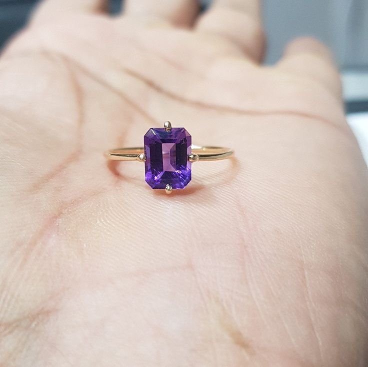 14k solid yellow gold natural emerald cut shaped amethyst gemstones ring. 1. The weight of the natural amethyst gemstone used in the ring =1.50 cts. 2. The weight of the 14k solid yellow gold used in the ring =1.170 grms. 3. The amethyst is the birthstone for the people born in the month of February. 4. The design of the ring is very nice and beautiful. 5. I have used all my skills and experience to manufacture this ring as beautiful as I can and I do hope that my work will be appreciated. Thank 14k Gold Purple Emerald Cut Rings, Purple 14k Gold Ring With Emerald Cut, Purple 14k Gold Rings With Emerald Cut, Emerald Cut Amethyst Ring For Formal Occasions, Rectangular Amethyst Ring In Yellow Gold, Yellow Gold Amethyst Ring With Rectangular Shape, 14k Yellow Gold Emerald-cut Amethyst Ring, Yellow Gold Amethyst Ring With Emerald Cut, Classic Yellow Gold Rectangular Amethyst Ring