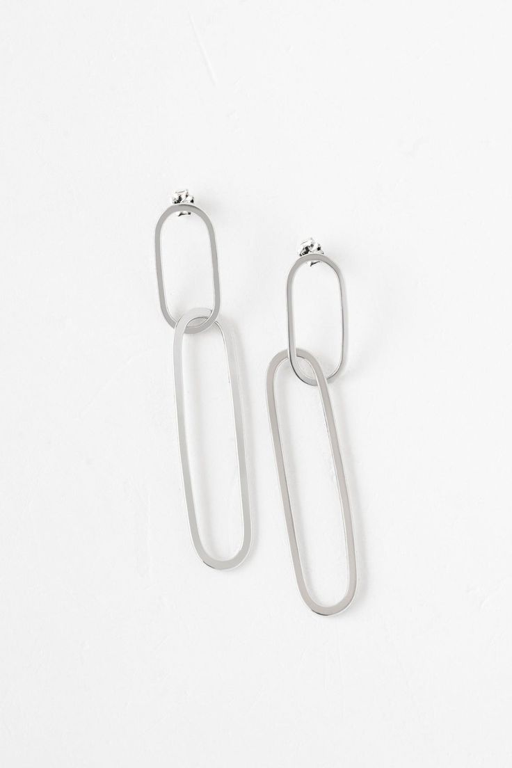 Keep it all together with the timeless style of the paperclip chain link. Handcrafted with careful attention to detail, the Ellipse Collection boasts an eye-catching linked design that is both a statement and lightweight. Classic yet modern, this collection is ageless. Handmade earrings featuring two interlocking metal hoops that create an elegant yet statement-making design. - Sterling silver and vermeil in high polish finish- Oxidized silver in satin finish- About 3" long Modern Sterling Silver Link Earrings, Modern Sterling Silver Chain Earrings, Sterling Silver Link Earrings For Everyday, Modern Oval Link Metal Earrings, Modern Link Shaped Metal Earrings, Modern Everyday Elegance Earrings, Modern Metal Earrings With Hooks And Links, Modern Metal Earrings With Hook Style, Silver Paperclip Everyday Earrings