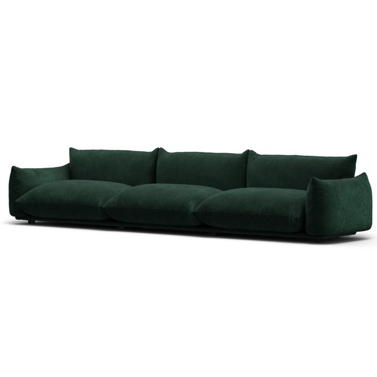 a dark green couch with pillows on the back and arms, in front of a white background