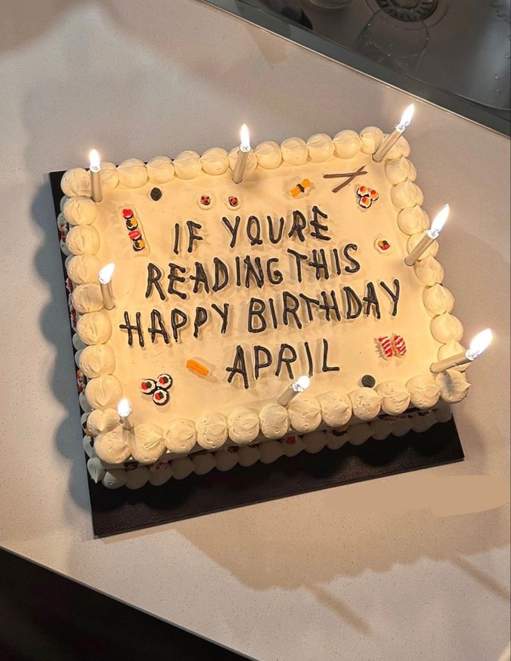 a birthday cake with candles on it that says if you're reading this happy birthday, appel