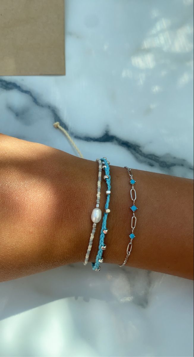 pretty blue bracelet aesthetic Blue Bracelets Aesthetic, Blue Summer Bracelets, Greece Jewelry Aesthetic, Blue Bracelet Stack, Summer Jewelry Silver, Summer Bracelets Aesthetic, Greece Bracelet, Blue Summer Jewelry, Light Blue Bracelet