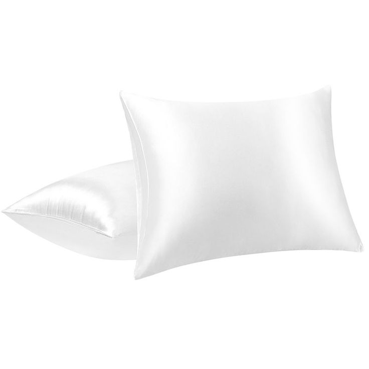 two white pillows sitting next to each other on top of a pillow case, one is plain and the other is plain