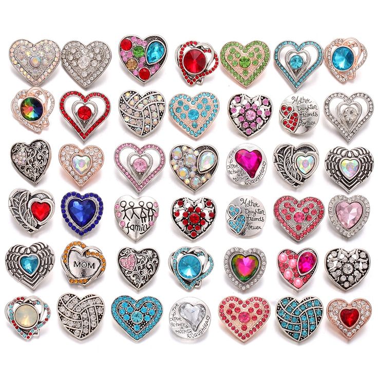 an assortment of heart shaped brooches are shown in various colors and sizes,