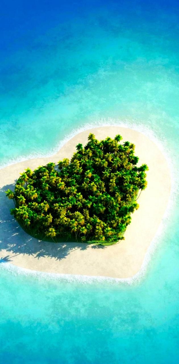 an island in the shape of a heart with trees on it is floating in the water