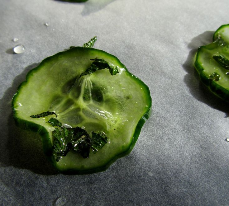 three pieces of green peppers with water droplets on them