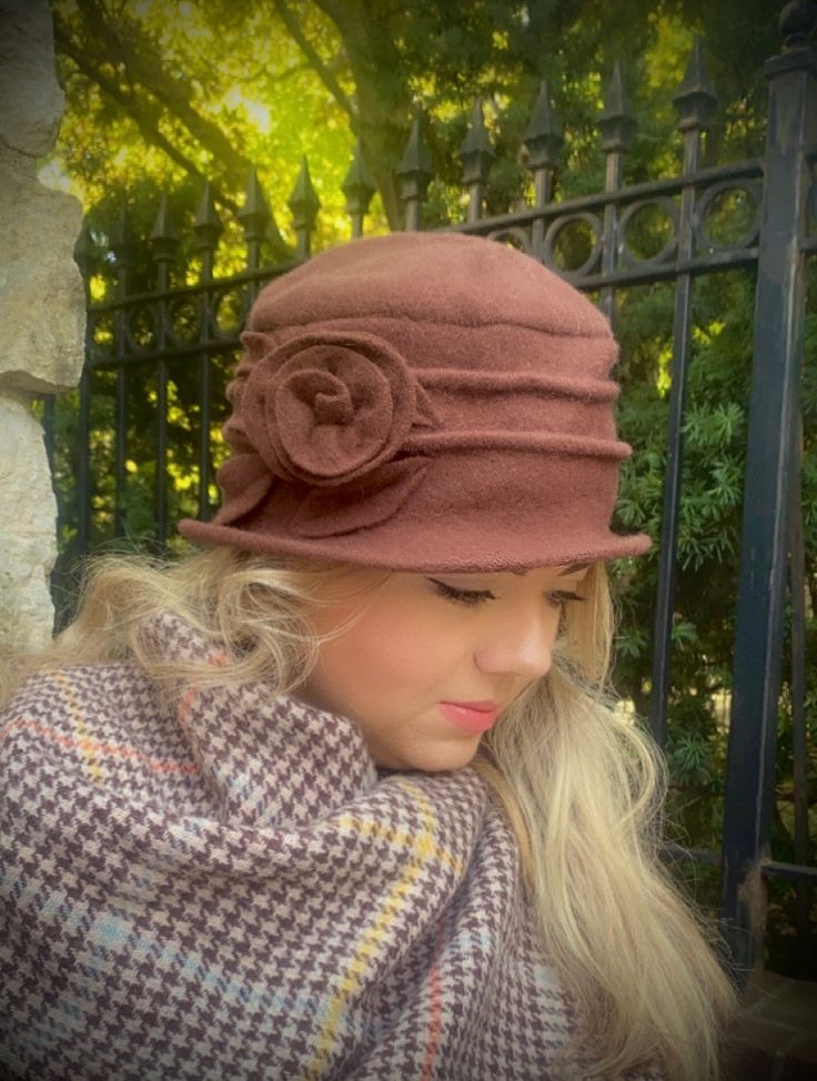 The demure wool cap that could be spotted at a Parisian café on a brisk autumn day…the wearer sipping a mocha cappuccino in the same rich brown hue. This cozy hat alludes to your eyes. (Also available in cream: White & Woolly Hat.) Pure, brushed cashmere blend is knit from soft yarns, and adorned with hand-turned piece-work appliquésOne comfy size fits all (we have tested the size on diverse heads!). Vintage Fall Felt Hat, Beige Brimmed Felt Hat For Winter, Classic Brown Hat For Fall, Elegant Brown Fedora For Fall, Brown Wool Fedora, Beige Short Brim Felt Hat For Winter, Beige Felt Hat With Short Brim For Winter, Brown Wool Cloche Hat With Short Brim, Brown Wool Cloche Hat With Curved Brim